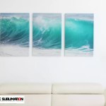 A three-panel triptych canvas wall art display featuring a vibrant turquoise ocean wave design mounted on a white wall above a couch, showcasing the FJK Sublimation brand logo watermark.