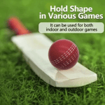 Red soft PU cricket ball resting on a wooden bat over green grass with indoor and outdoor play text.