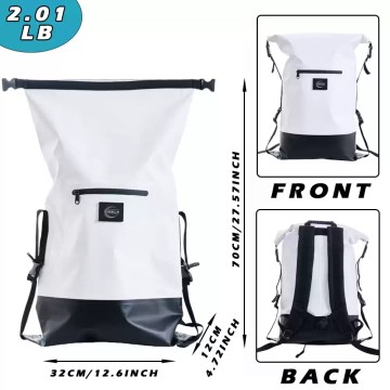 The dry bag packed with a towel and electronics for a beach trip.