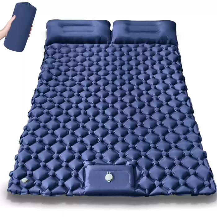 Outdoor camping double inflatable mattress showing its extra wide design and built-in pillows.