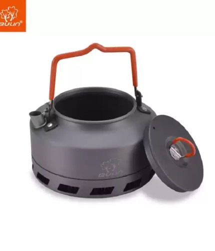 A hiker pouring boiling water from the 1.1L energy saving kettle into a coffee mug.