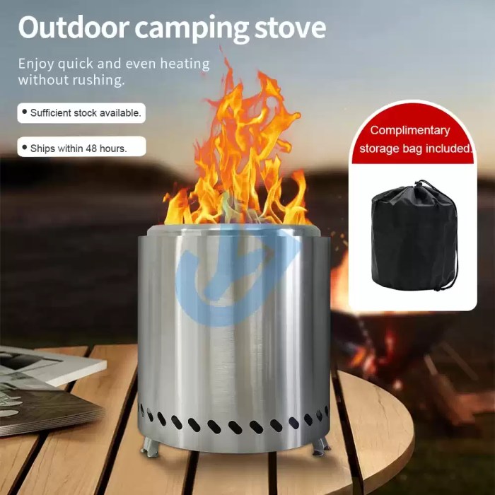 Outdoor camping smokeless stove with a bright, clean flame in a forest setting.