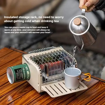 Portable cassette gas heater keeping tea warm while pouring hot water, compact outdoor camping heater for travel and cold weather use.