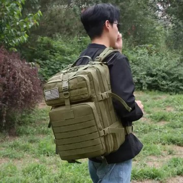 Sequence showing the hiking backpack being folded into its own small pocket.