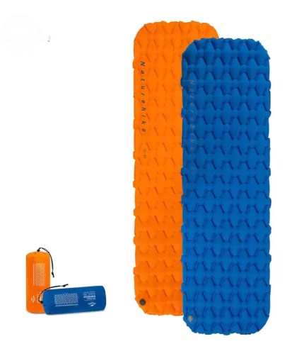 Ultralight camping mattress showing the blue egg-tray air cell design in a forest.