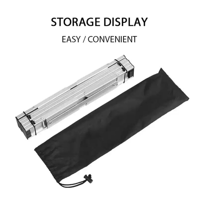 Mini camping table and a lightweight stool set up on a beach for a sunset picnic.