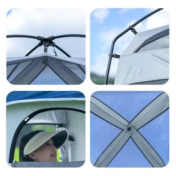 Privacy fishing tent set up by a lake to protect against wind and rain.