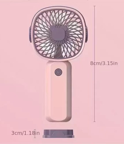 Small handheld USB fan shown next to a smartphone to demonstrate its compact travel size.
