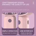 Close-up of the USB charging port on a rechargeable portable fan with its indicator light on.