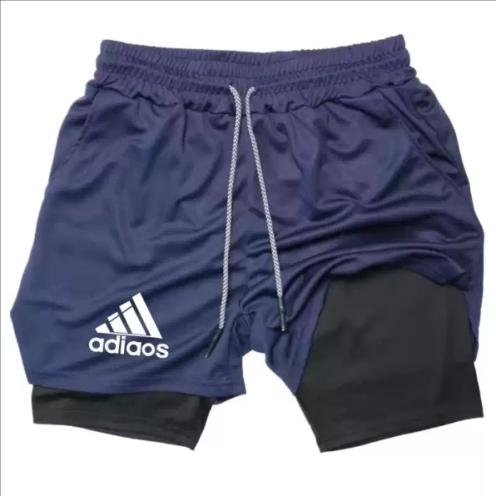 Navy blue sports shorts featuring a black inner liner for active workouts.