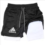 Black training shorts with a white inner compression layer and drawstring waist.