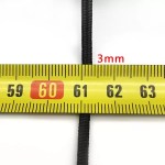 A hiker using the 3mm paracord to secure gear to a 70L camping backpack.