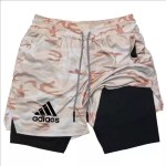 Camouflage patterned outer shorts with a solid black inner compression liner.