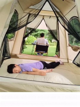 Quick-pitch inflatable camping tent showing the air valve system for effortless assembly on family camping trips.
