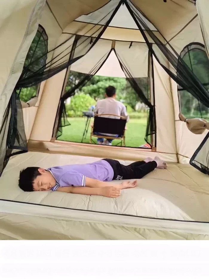 Quick-pitch inflatable camping tent showing the air valve system for effortless assembly on family camping trips.