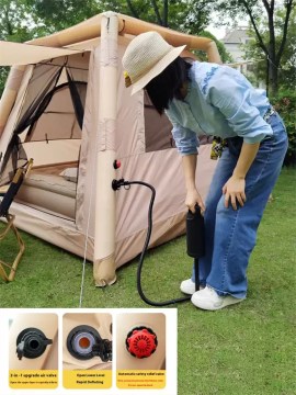Durable manual air pump and heavy-duty pegs included with a portable inflatable tent for UK wilderness expeditions.