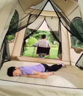 Spacious interior of a glamping air shelter with luxury camping mats for tents.