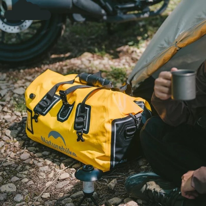 Roll-top waterproof bag on hiking trip.