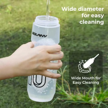 Close-up of the transparent plastic kettle showing the protective lid and nozzle.