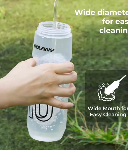 Close-up of the transparent plastic kettle showing the protective lid and nozzle.