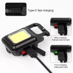 EDC keychain light with integrated corkscrew for camping.