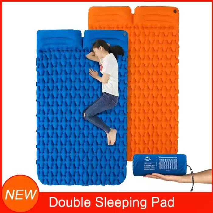 Alt Text: Ultralight 2 person inflatable mattress for couple backpacking shown fully inflated on a scenic mountain campsite.