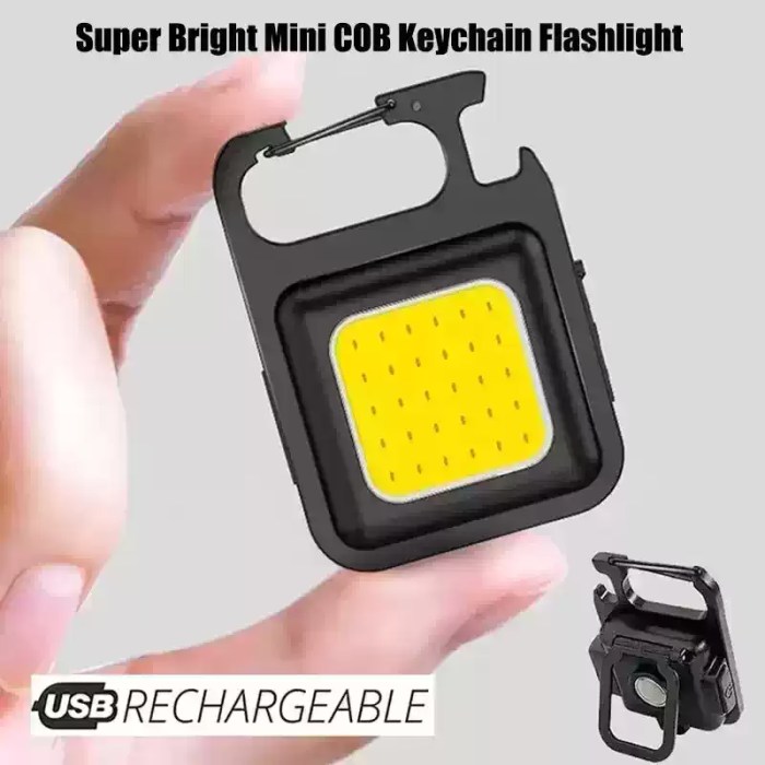 A compact black super bright mini COB keychain flashlight connected to a charging cable, showing a red indicator light during charging and a bright green light when fully charged.