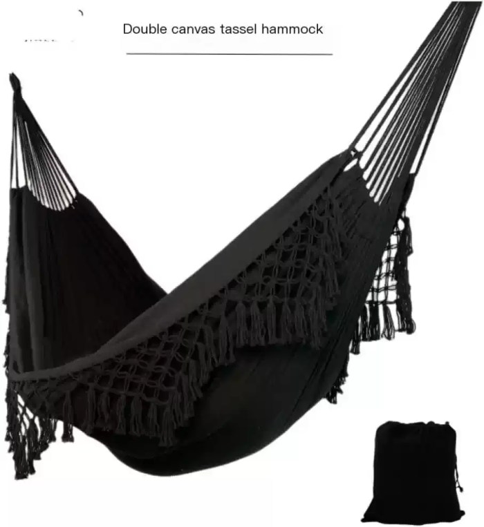 DOUBLE ENLARGED CANVAS HAMMOCK_1 A couple relaxing in the enlarged double hammock inside a cozy sunroom.