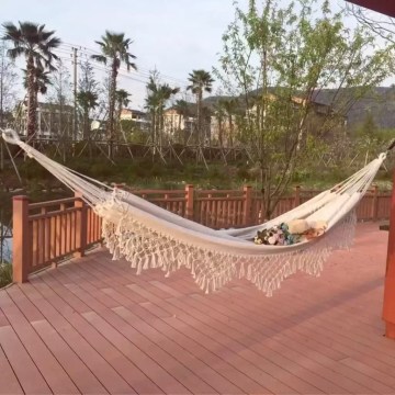 The retro canvas hammock folded into its matching blue travel carry bag.
