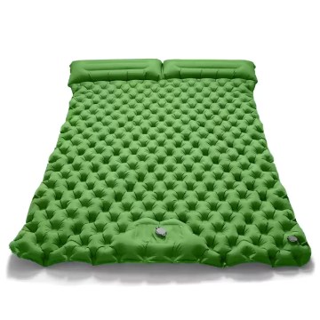 Double inflatable dot mattress in blue with the free air pump shown beside it.