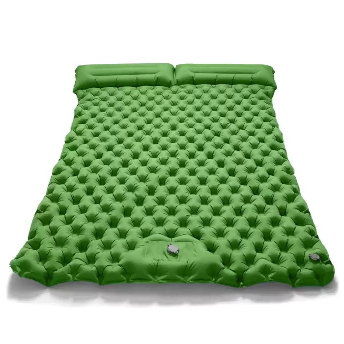 Double inflatable dot mattress in blue with the free air pump shown beside it.