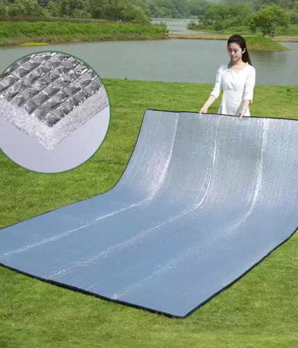 Outdoor camping foam foil mat with reflective aluminum surface.