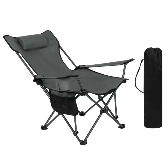 Lightweight outdoor chair with anti-sink feet placed on a sandy beach during a sunset picnic.
