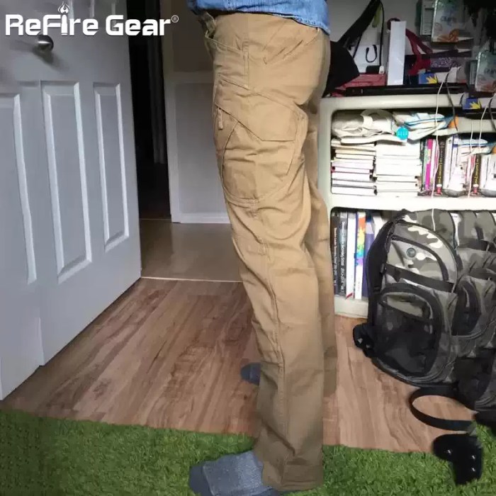 Man kneeling wearing ReFire Gear beige tactical cargo pants, highlighting knee seam detail and side pockets.