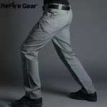 Side view of ReFire Gear khaki tactical cargo pants worn indoors.