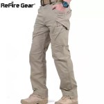 ReFire Gear men's tactical cargo pants in beige, side profile view with tan combat boots.