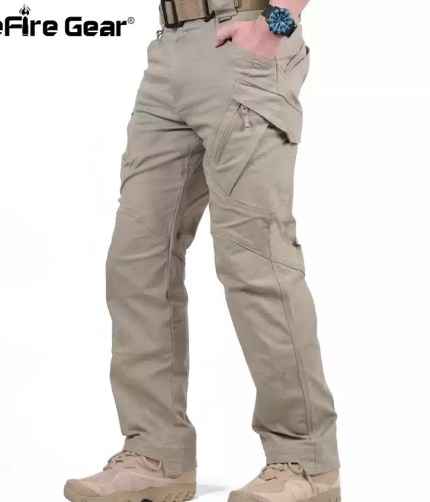 ReFire Gear men's tactical cargo pants in beige, side profile view with tan combat boots.