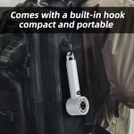 Portable fan with hook hanging from a camping tent.