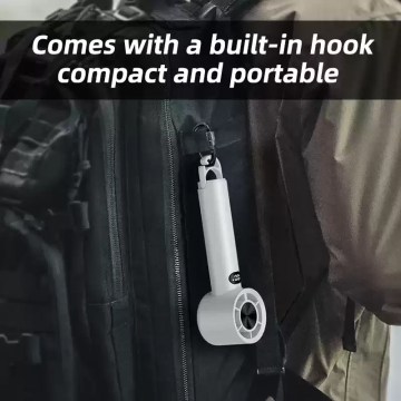 Portable fan with hook hanging from a camping tent.