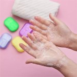 Close up of a single soap sheet dissolving in a palm.