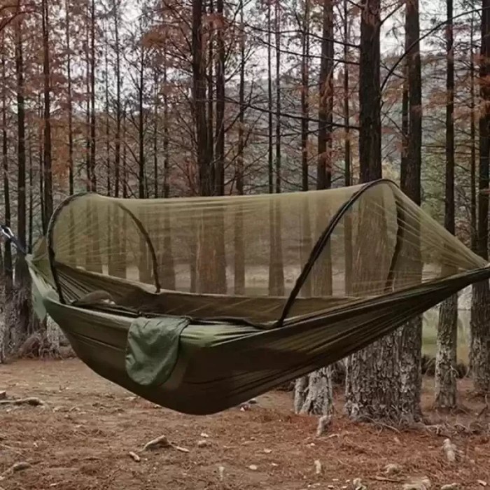 MOSQUITO NET CAMPING HAMMOCK_6 Outdoor camping hammock with mosquito net showing the fine mesh enclosure in a forest.