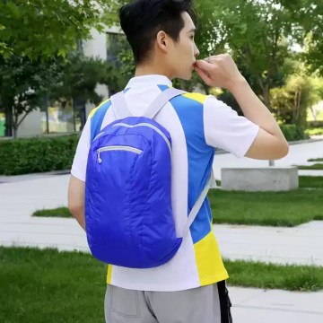 Compact foldable backpack worn for daily travel and light hiking