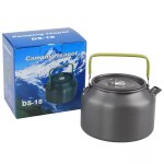 Dark grey DS18 alloy kettle sitting on a portable table at a forest campsite.