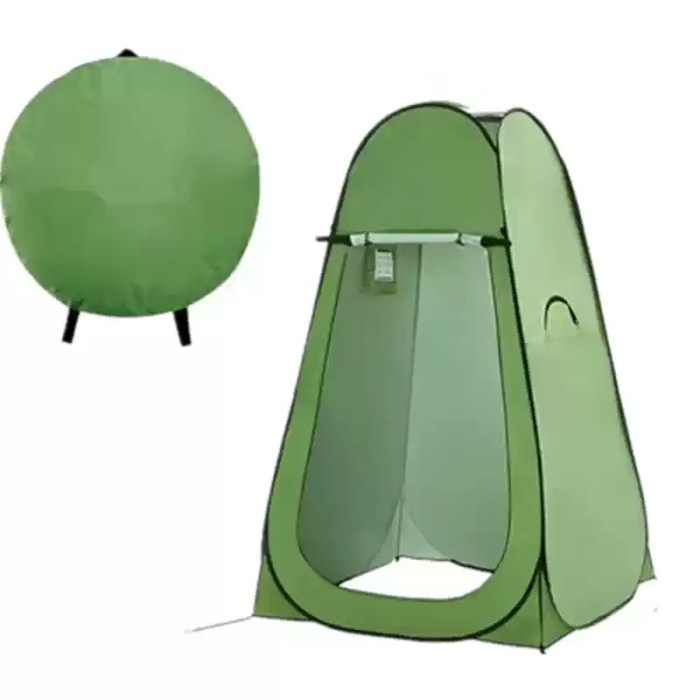 A green privacy tent used as a beach changing room for swimmers.