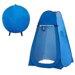 Blue portable camping shower tent standing tall in a green forest clearing.
