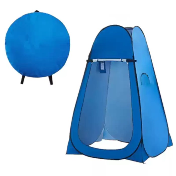 Blue portable camping shower tent standing tall in a green forest clearing.