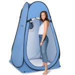 Blue pop up privacy shelter on a beach.