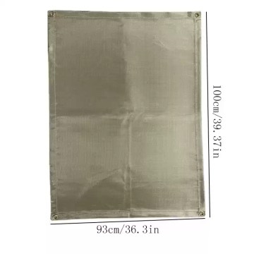 Temperature resistant insulation pad protecting a wooden patio deck under a portable BBQ grill.