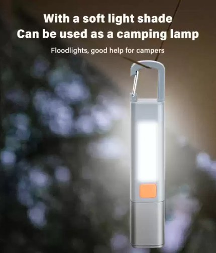 Camping light with hook hanging inside a tent for illumination.