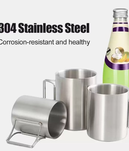 A hiker using the 400ml stainless steel coffee mug during a sunrise nature hike.